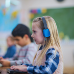 girl using multimedia in school